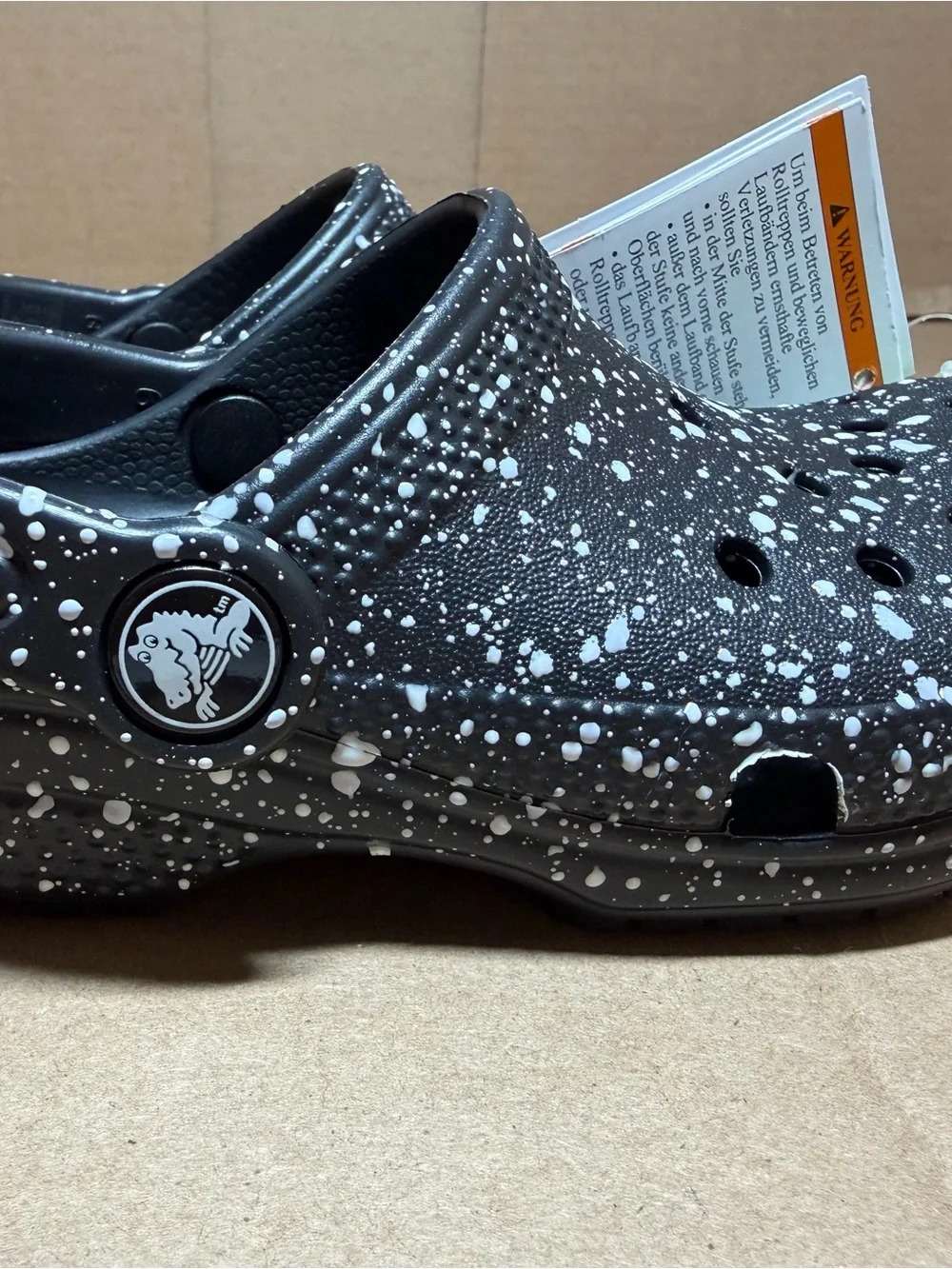 CROCS Kids' Classic Clog in Black with White Paint Splatter